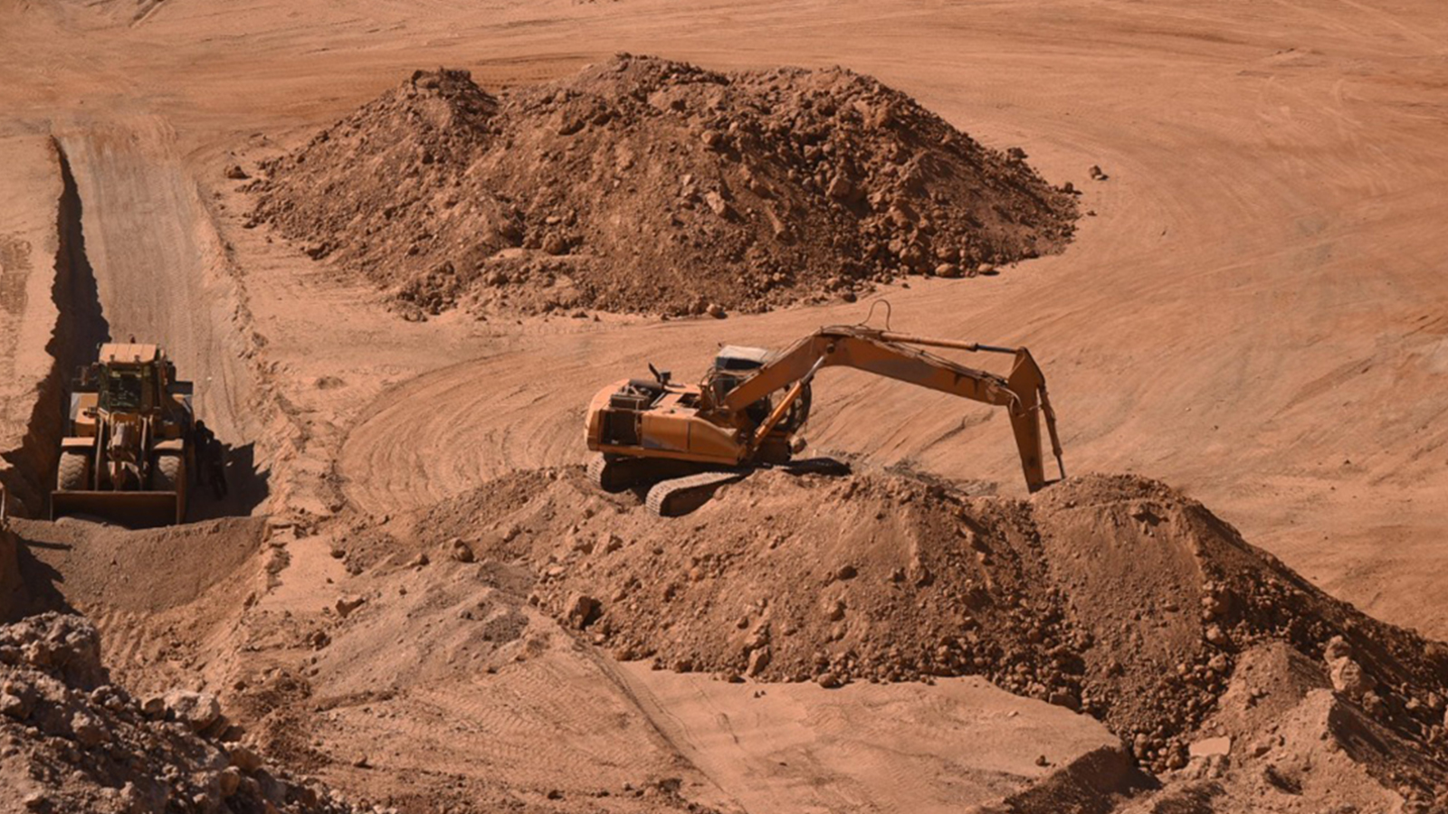 Heavy drilling equipment in a mountainous rocky area